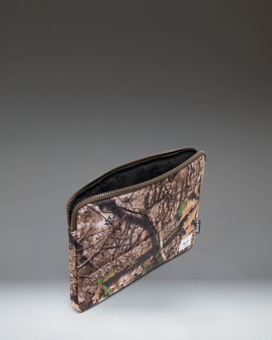 Herschel Supply Co. Realtree Anchor 14 Inch Sleeve in Realtree APX Camo.