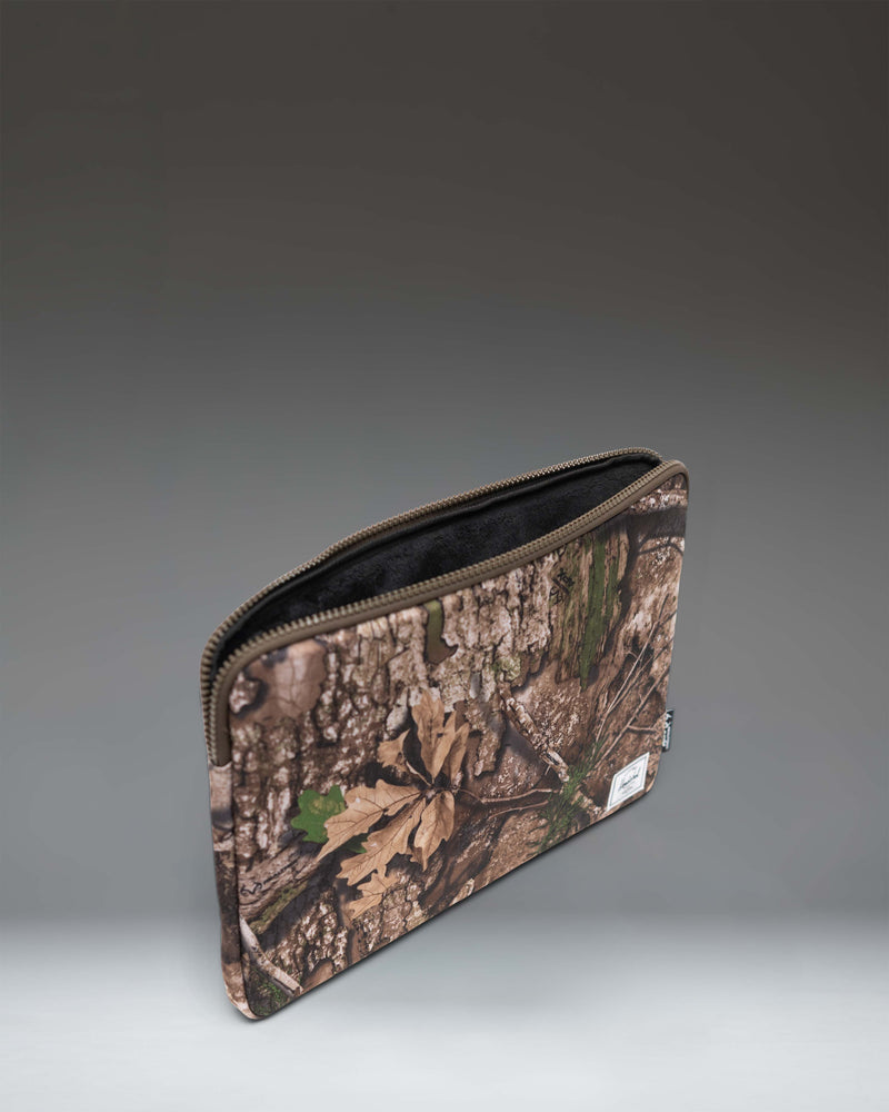 Herschel Supply Co. Realtree Anchor 15-16 Inch Laptop Sleeve in Realtree APX Camo pattern.
