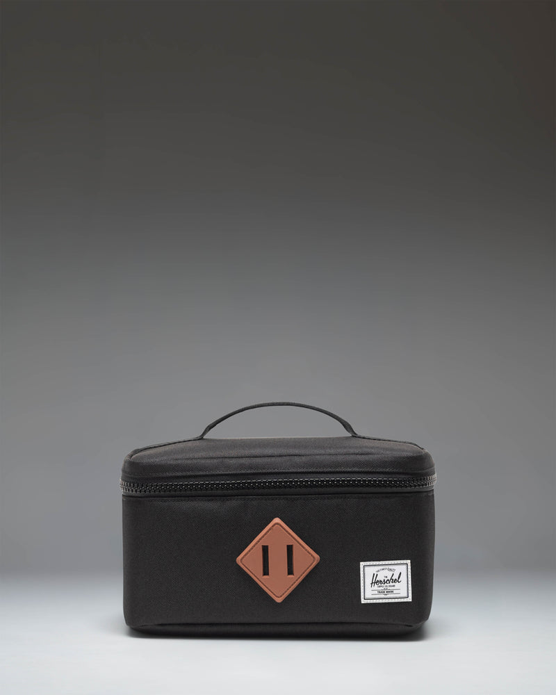 Herschel Heritage Lunch Box Little Herschel in black, featuring a classic rectangular design with a top handle and front storage sleeve.