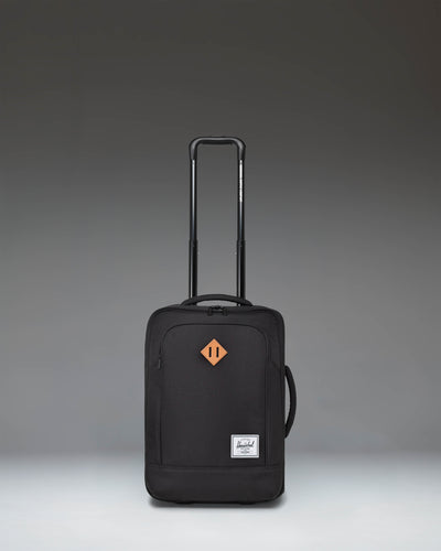 Herschel Heritage Softshell Large CarryOn Luggage in Black, showcasing a durable exterior, sleek wheels, and a sturdy telescoping handle.