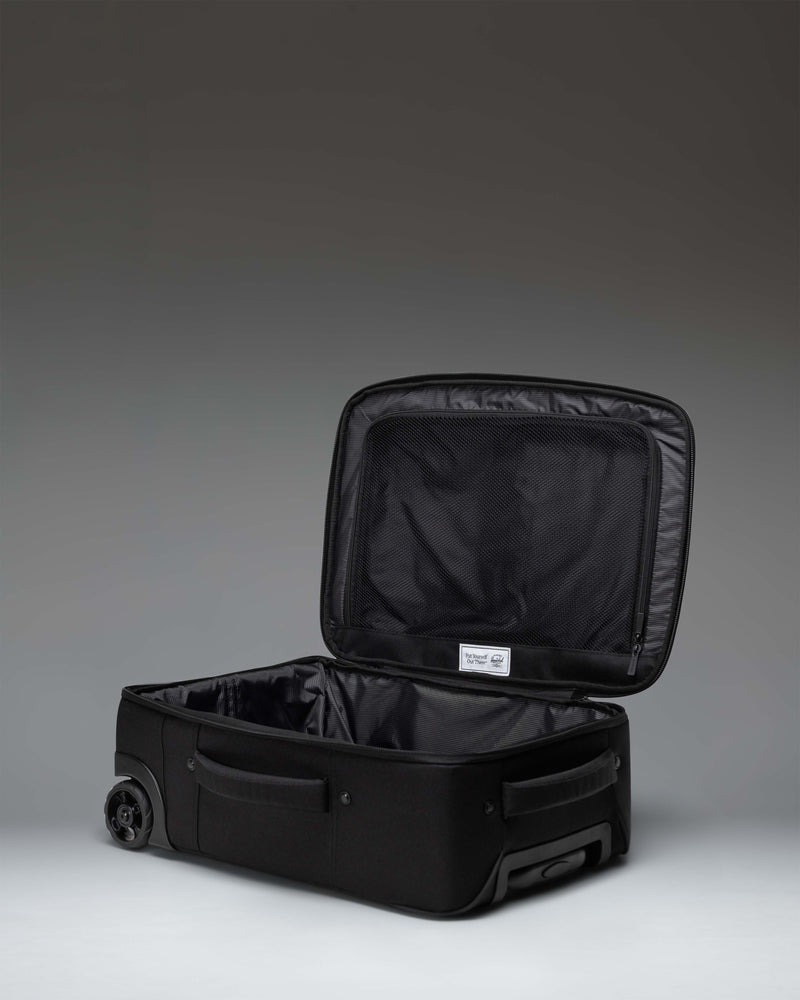 Black Herschel Heritage Softshell Large Carry-On Luggage, featuring its sleek black exterior and durable softshell design.