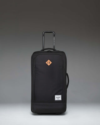 Herschel Heritage Softshell Medium Luggage in black, showing an oversized view of the front exterior fabric, zipper, and subtle tonal branding.