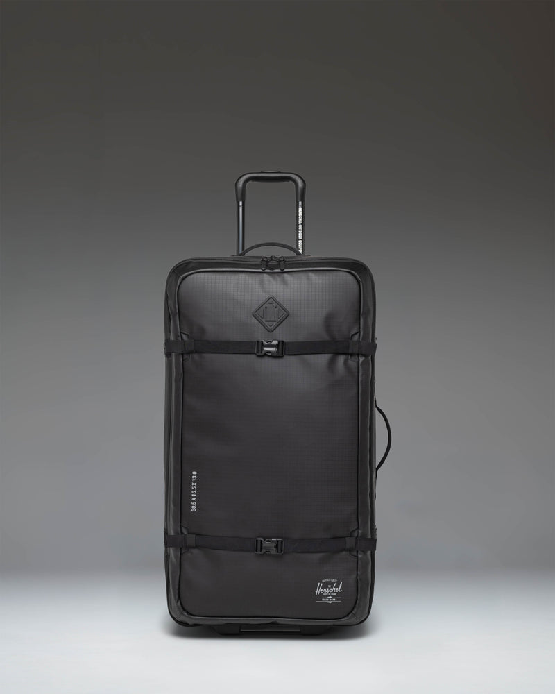 Herschel Supply Co All Season Hybrid Roller Bag Large in Black, shown from an oversized front angle view.