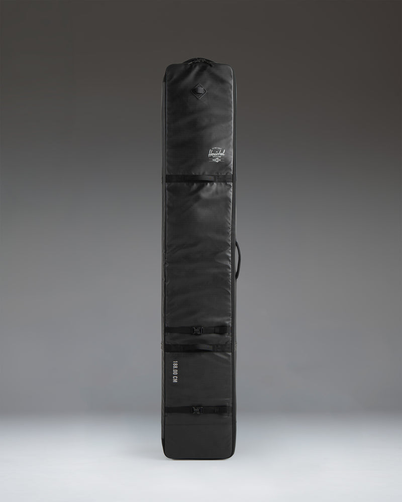 Herschel Supply Co. Snow Roller Bag 168cm in black, shown from a side profile view.