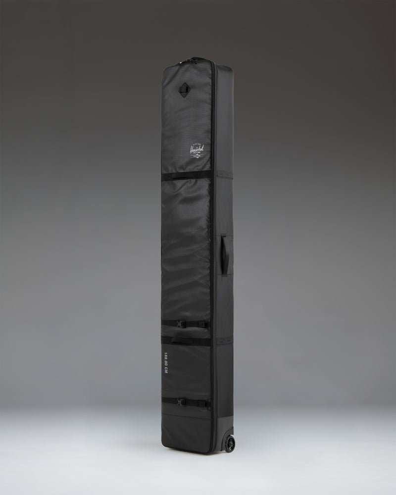 Herschel Supply Co. Snow Roller Bag 168cm in black, shown from an oversized side angle perspective.