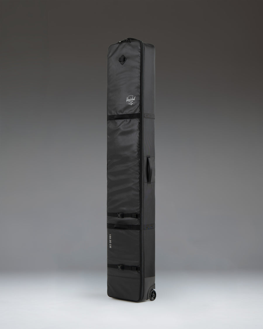 Herschel Supply Co. Snow Roller Bag 168cm in black, shown from an oversized side angle perspective.