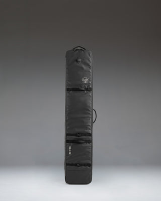Herschel Supply Co. Snow Roller Bag 188cm in solid black, a durable wheeled travel bag designed to protect and transport snowboards and ski gear.