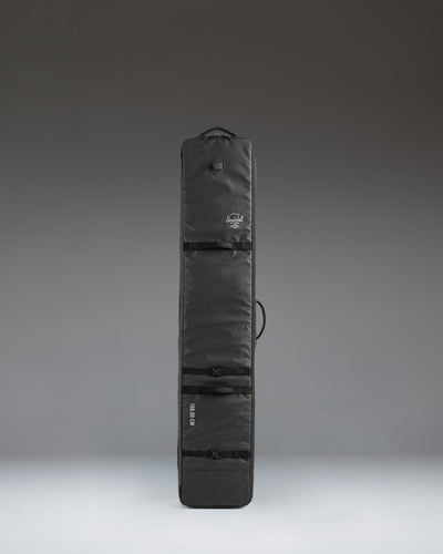 Herschel Supply Co. Snow Roller Bag 188cm in solid black, a durable wheeled travel bag designed to protect and transport snowboards and ski gear.