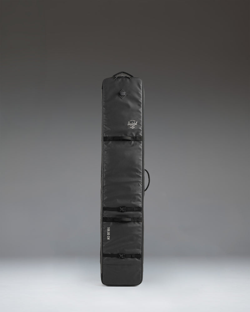 Herschel Supply Co. Snow Roller Bag 188cm in solid black, a durable wheeled travel bag designed to protect and transport snowboards and ski gear.