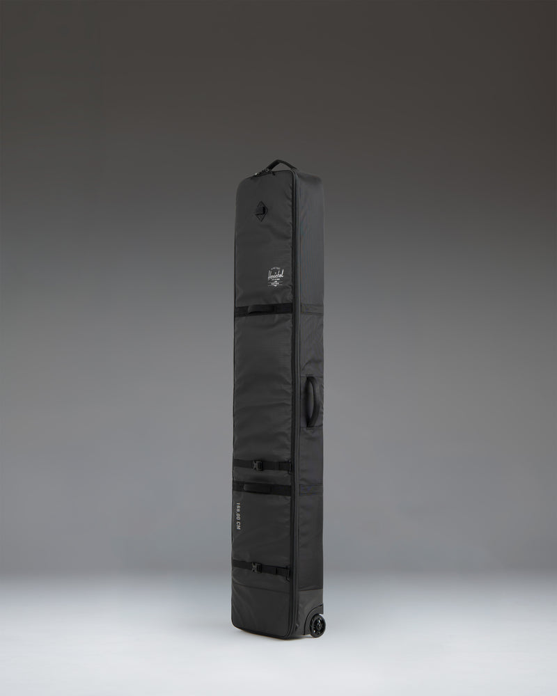 Herschel Supply Co. Snow Roller Bag 188cm in black, showing a detailed view of the durable travel bag exterior.
