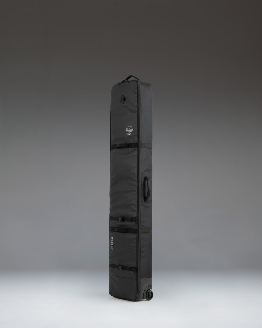 Herschel Supply Co. Snow Roller Bag 188cm in black, showing a detailed view of the durable travel bag exterior.