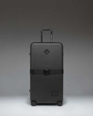 Herschel Heritage Hardshell Large Luggage Exp in Black, showing the front view of the durable rolling suitcase.