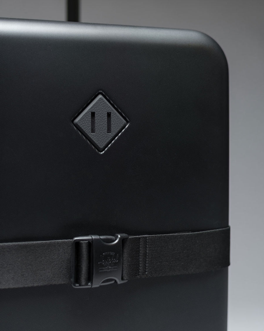 Herschel Heritage Hardshell Large Luggage Exp displayed in a variety of available colors.