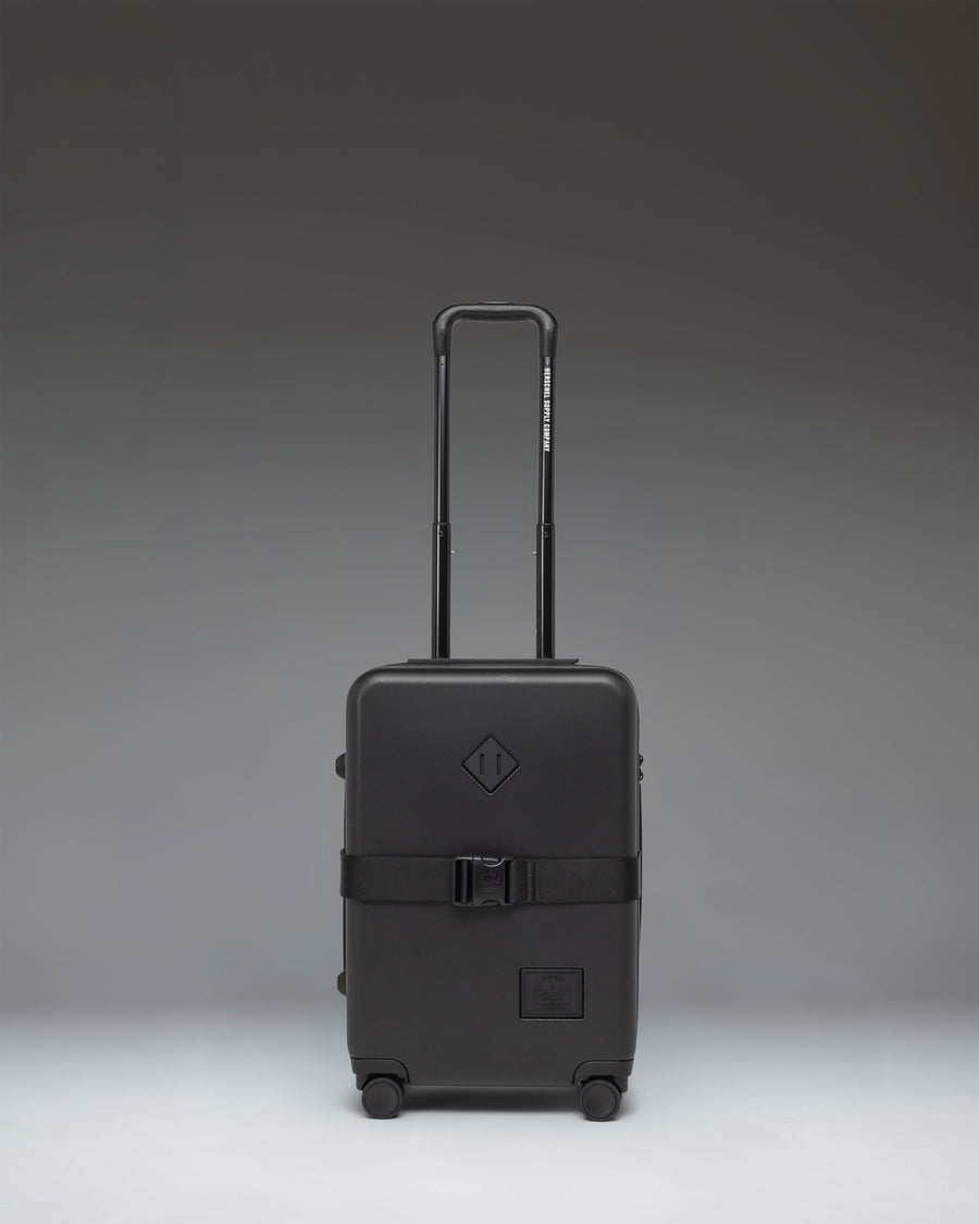 Black Herschel Heritage Hardshell Large Carry On Exp suitcase in Black, front view.