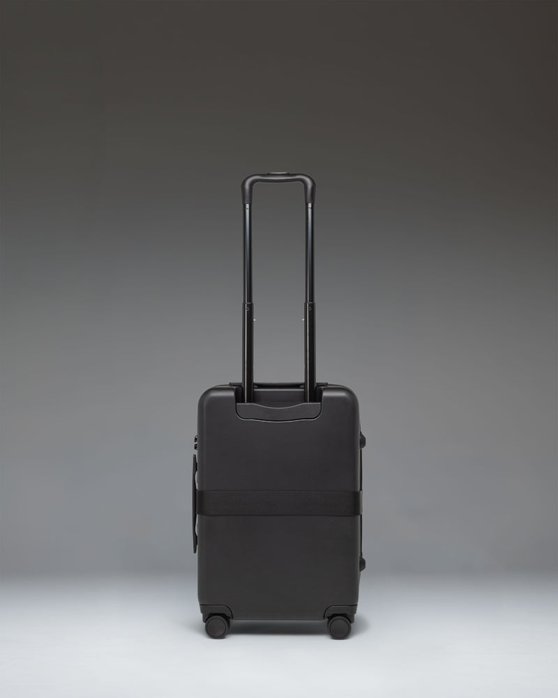 Black Herschel Heritage Hardshell Large Carry On Exp luggage bag.