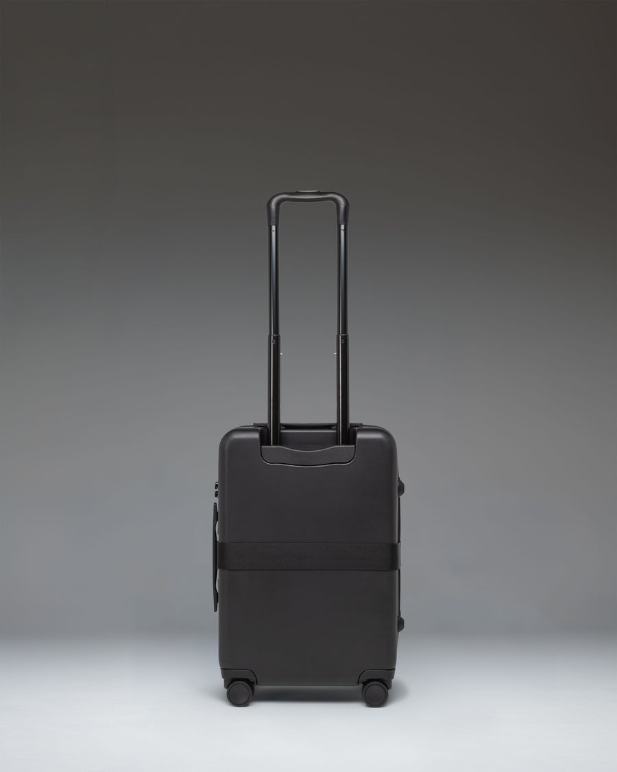 Black Herschel Heritage Hardshell Large Carry On Exp luggage bag.