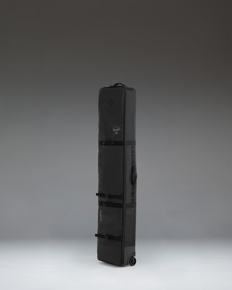 Black Herschel Supply Co. Snow Roller Bag 158cm, featuring a durable design for transporting snowboards and ski gear.
