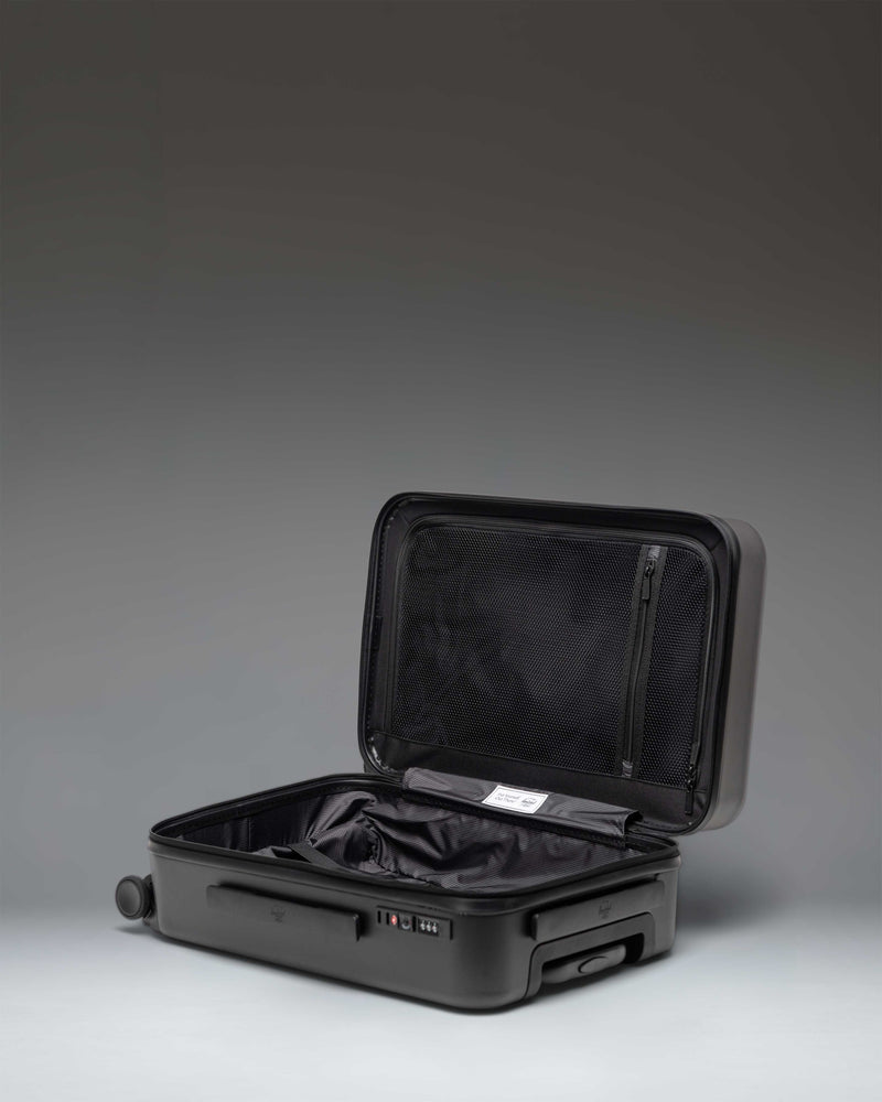 Black Herschel Heritage Hardshell Large Carry-On Luggage.