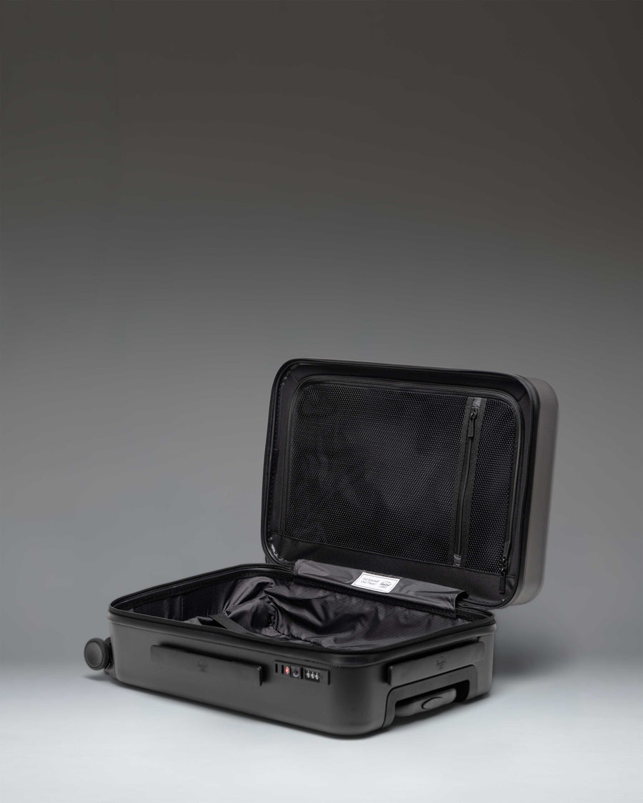 Black Herschel Heritage Hardshell Large Carry-On Luggage.