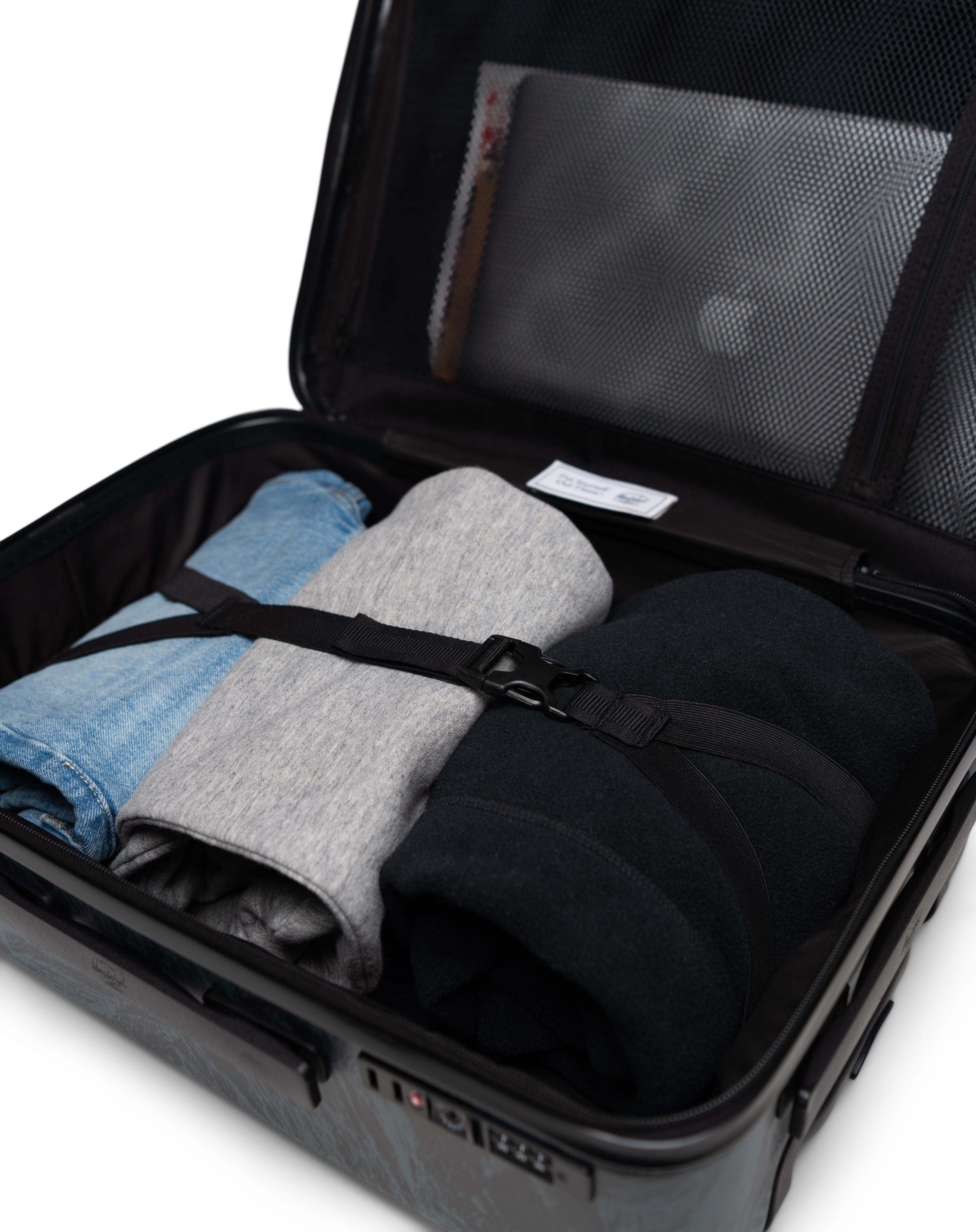 Herschel Supply Co. Heritage Hardshell luggage size guide chart showing dimensions for Carry On, Large Carry On, Medium, and Large sizes.