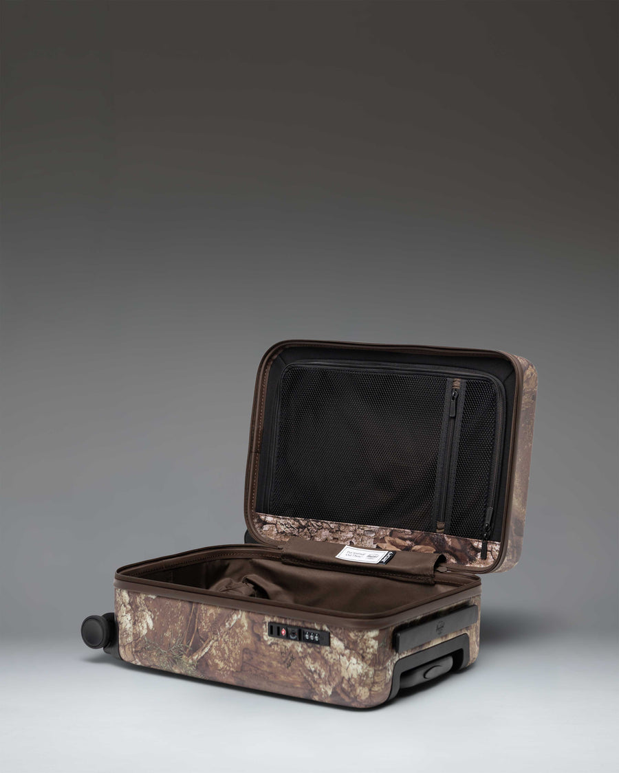Realtree Herschel Heritage Carry On Luggage in Realtree APX Camo.