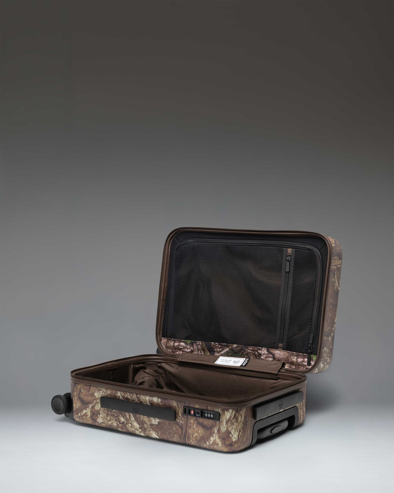 Realtree Herschel Heritage Large CO Luggage in Realtree APX Camo.