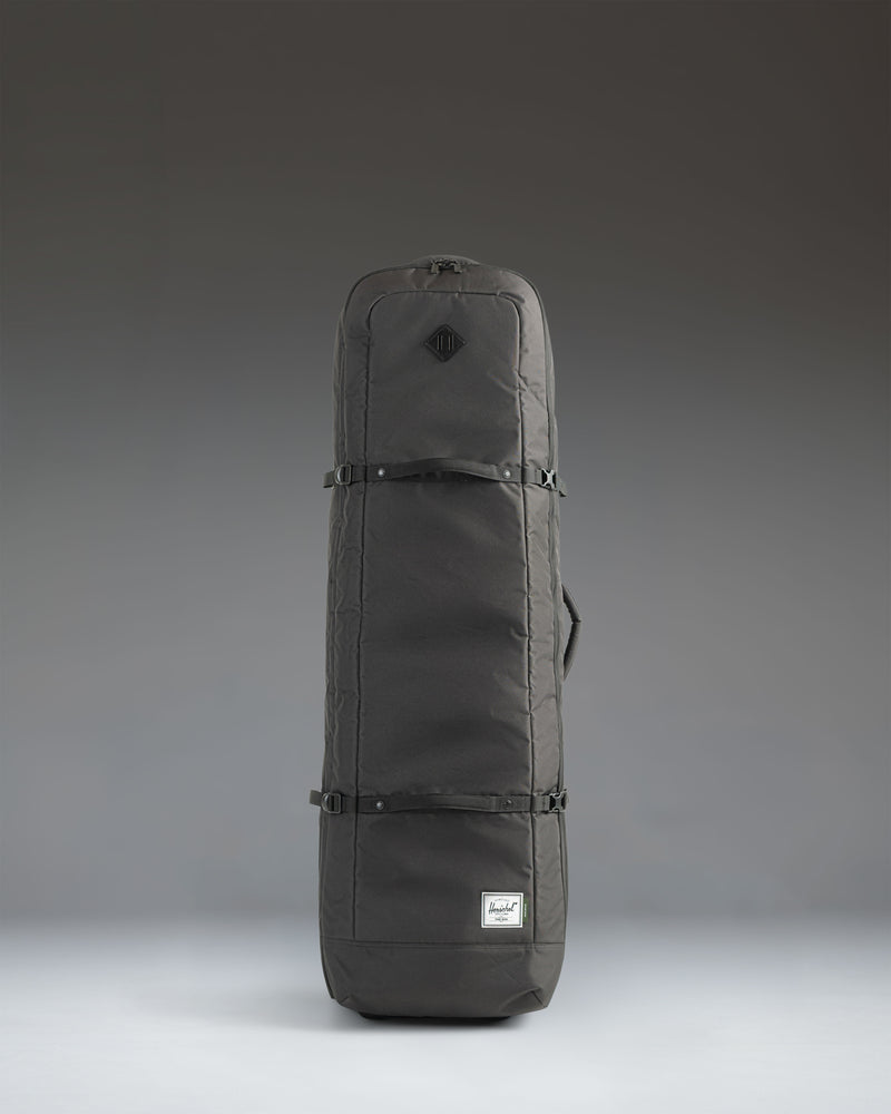Black Herschel Heritage Golf Travel Wheelie Bag showing the overall exterior design and wheels.