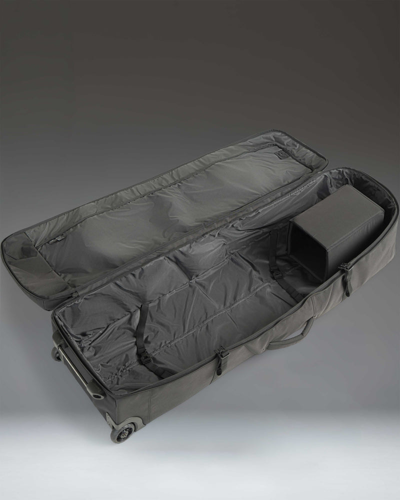 Herschel Heritage Golf Travel Wheelie Bag in black, featuring a structured design, durable wheels, and a reinforced handle for travel.