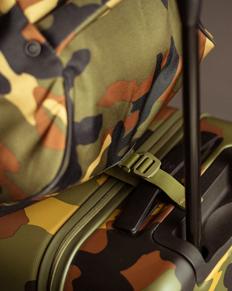 Herschel Heritage Golf Travel Wheelie Bag showing all color options including black, navy, woodland camo, and ash rose.