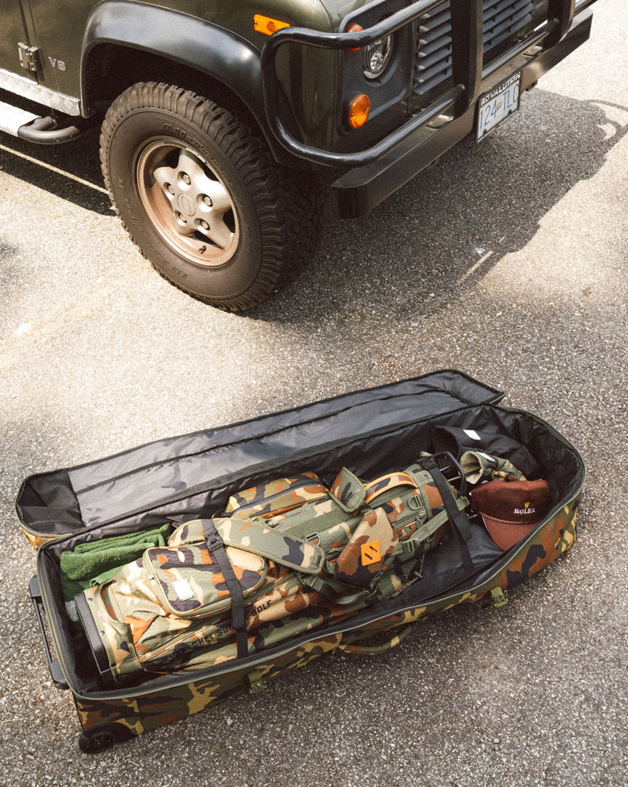 Herschel Heritage Golf Travel Wheelie Bag in Navy/Saddle Brown, showing all available colors from a front view.