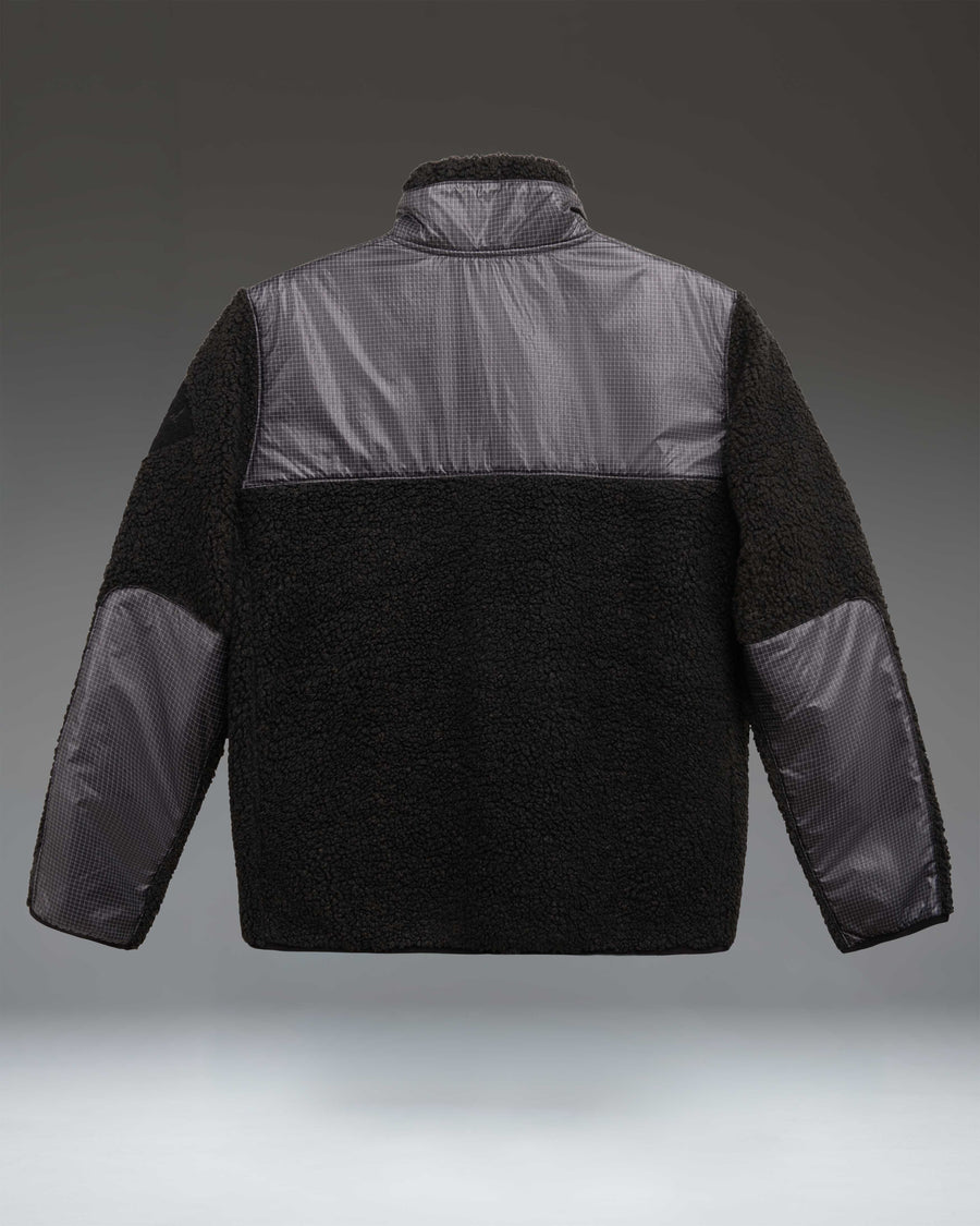 Herschel Supply Co. Men's Performance Fleece Jacket in black, featuring a full-zip front, zippered chest pocket, and subtle logo detail.