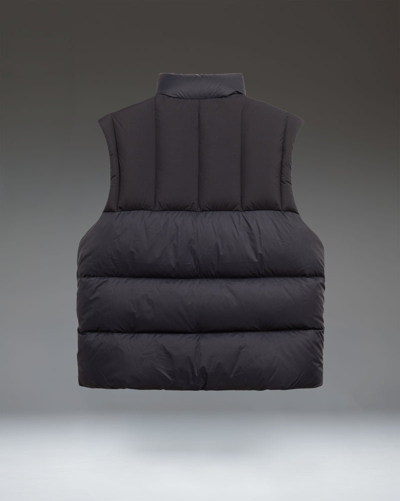 Herschel Supply Co. Men's Puffer Vest in solid black, featuring a sleeveless quilted design with a high collar and full-front zipper closure.