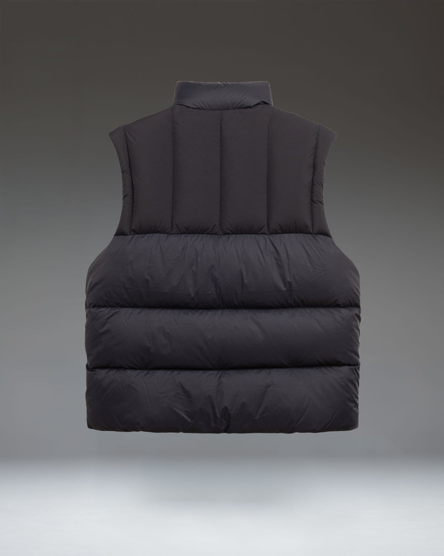 Herschel Supply Co. Men's Puffer Vest in solid black, featuring a sleeveless quilted design with a high collar and full-front zipper closure.