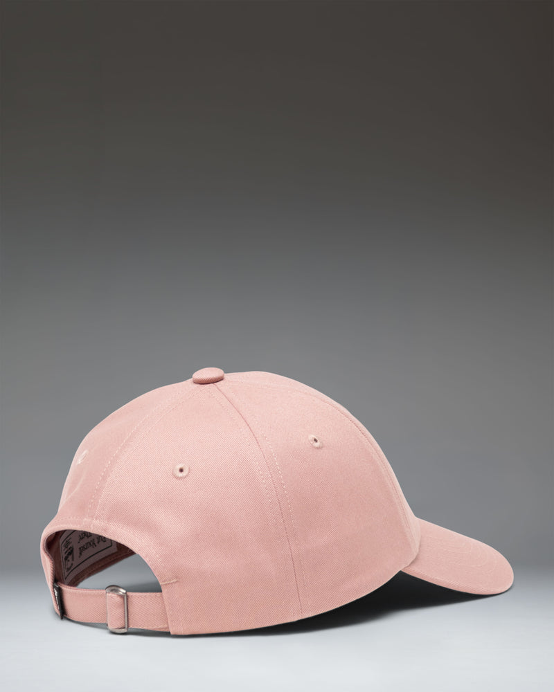 Side view of the Herschel Supply Co. Sylas Classic Cap in Ash Rose, showing the unstructured crown and adjustable strap.