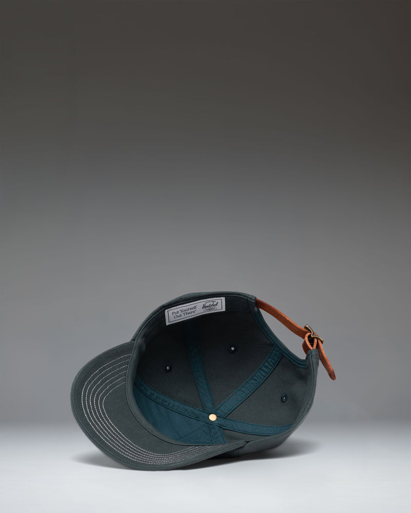 Herschel Sylas Premium Cap in Green Gables with vintage white contrast stitching, unstructured low crown, and curved brim.