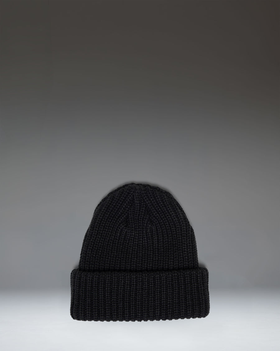 Herschel Supply Co Douglas Beanie in black, featuring a classic ribbed knit design with a folded cuff and a small woven logo label on the front.
