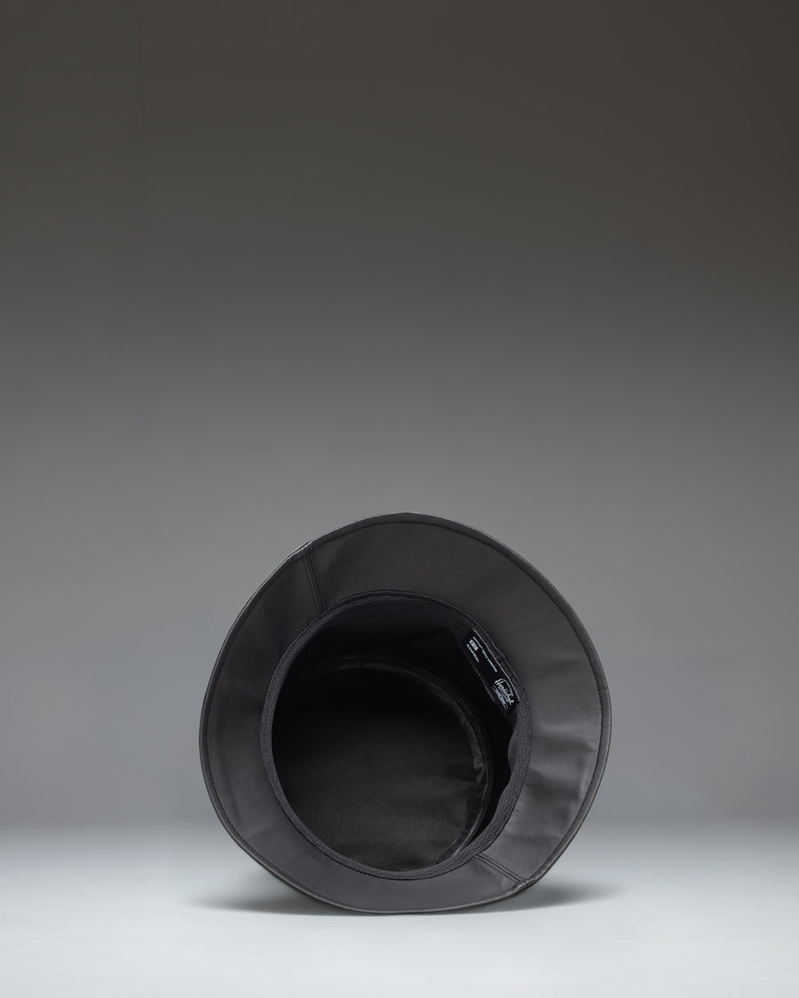 Size guide chart for Herschel Supply Co Norman Rain Bucket Hat in Black, showing measurements for all available sizes.