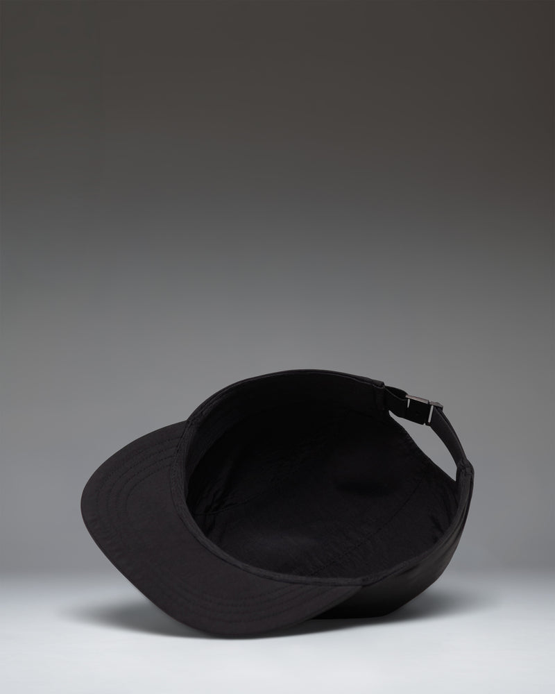Herschel Supply Co. Glendale Packable Cap in black shown from a side profile view, highlighting its lightweight and unstructured design.
