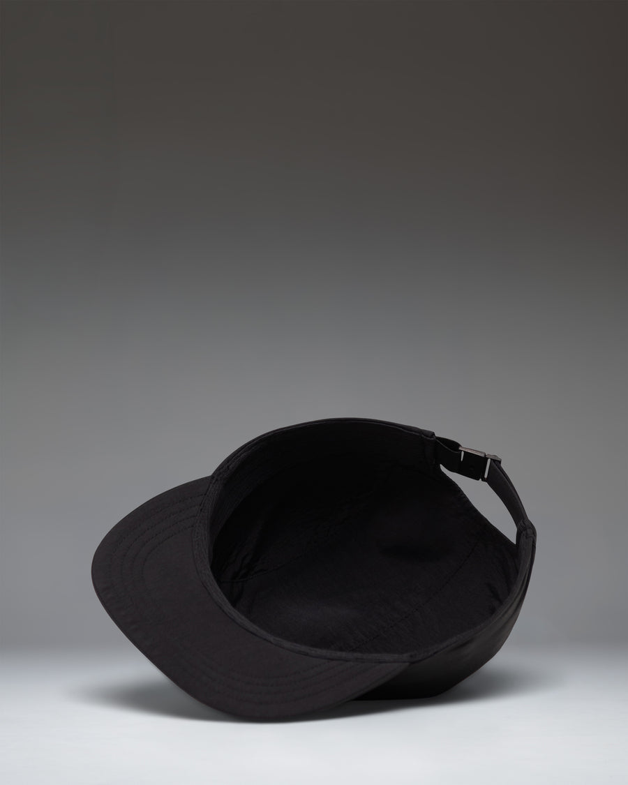 Herschel Supply Co. Glendale Packable Cap in black shown from a side profile view, highlighting its lightweight and unstructured design.