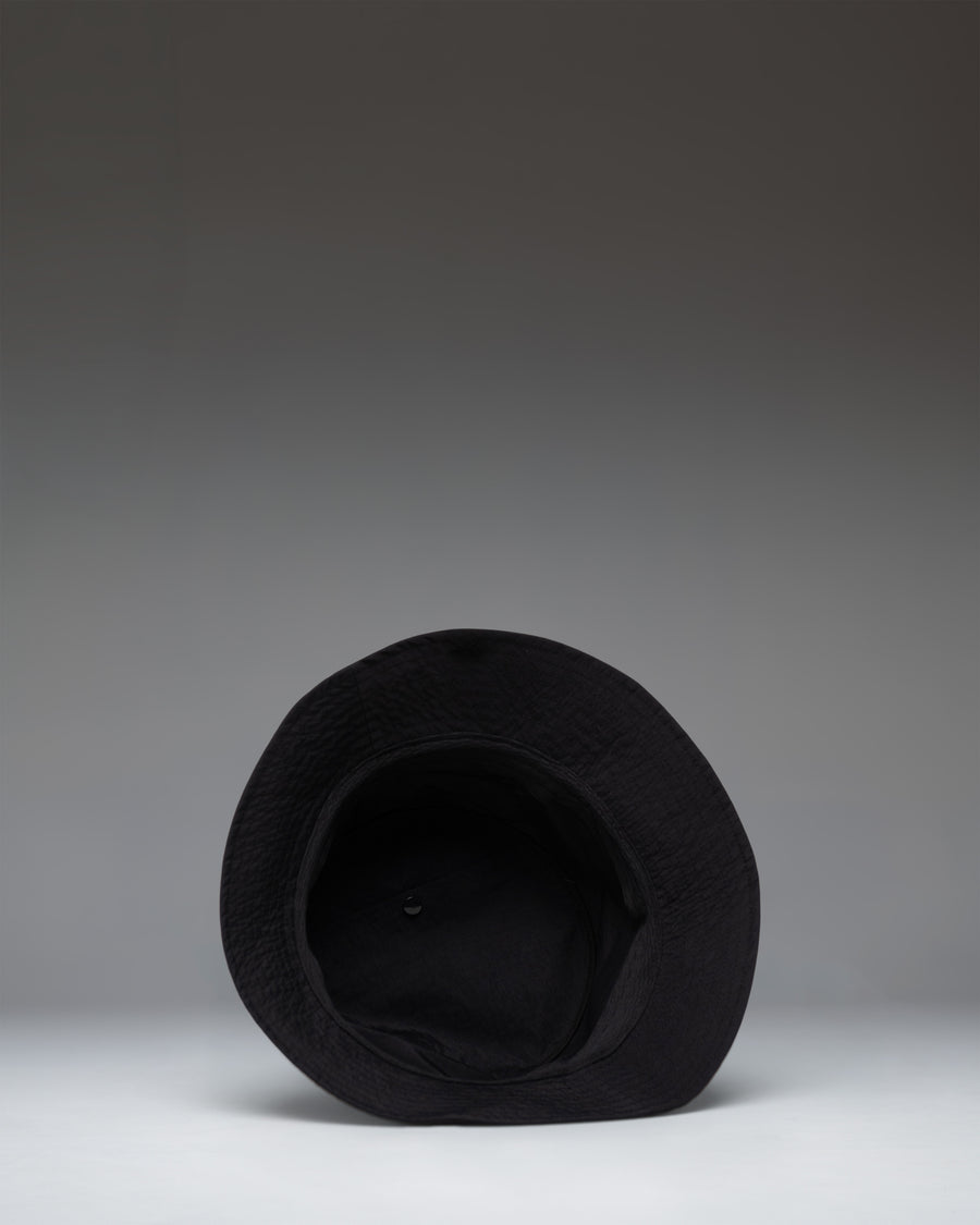 Black Herschel Supply Co. Norman Packable Bucket Hat size guide chart showing measurements for all available sizes.