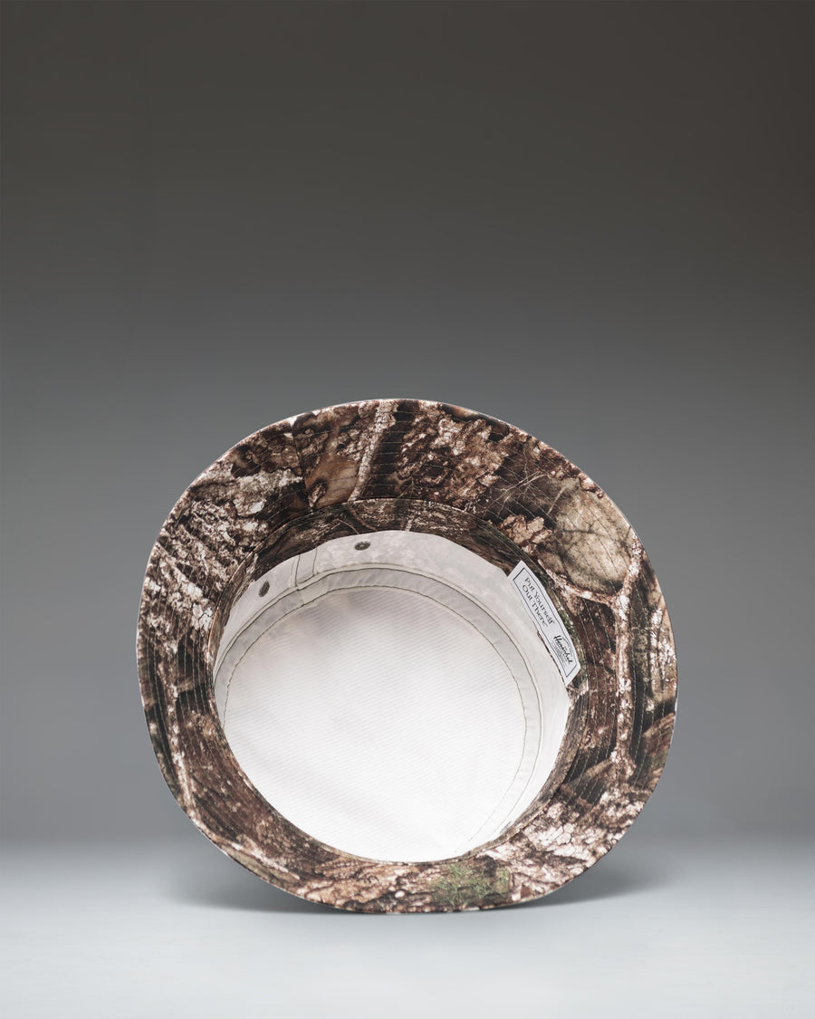 Herschel Supply Co. Norman Bucket Hat in Realtree APX Camo pattern, a comfortable classic unstructured low crown hat for everyday wear.
