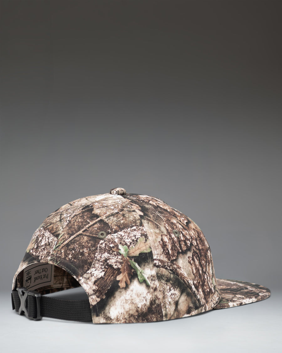 Herschel Supply Co. Realtree Scout Cap in Realtree APX Camo pattern, showing the side view of the adjustable strap and unstructured crown.