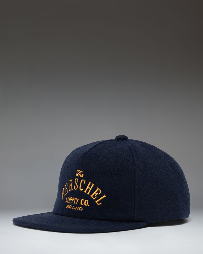 Herschel Supply Co. Scout Heritage Cap in Darkest Navy, a classic six-panel baseball hat with an adjustable strap back.
