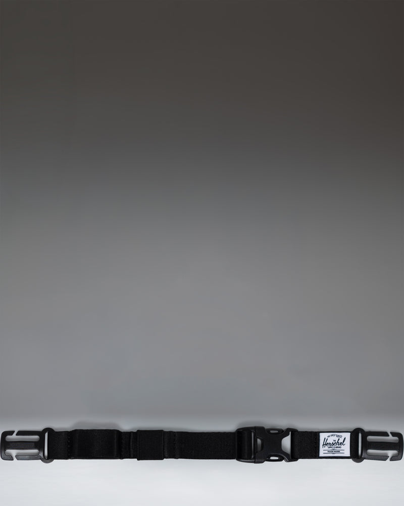 Herschel Supply Co adjustable sternum strap in black, designed to attach to backpack shoulder straps for added support.
