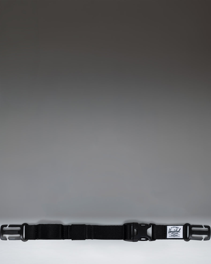Herschel Supply Co adjustable sternum strap in black, designed to attach to backpack shoulder straps for added support.