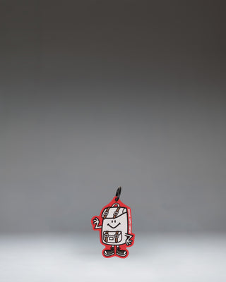 A miniature Herschel backpack bag charm in Tango Red featuring a front pocket, classic logo, and a snap hook for attaching to bags.