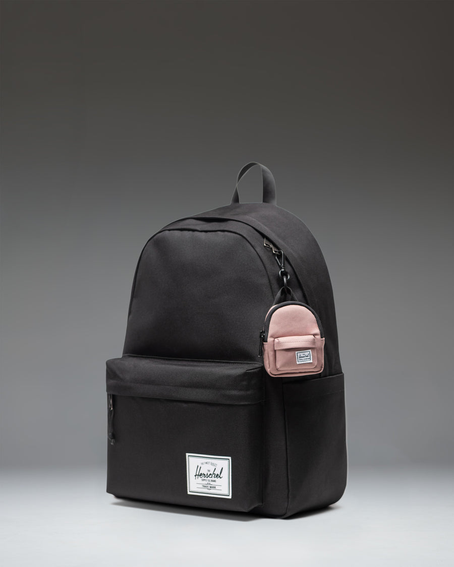 Herschel Classic Backpack Bag Charm in Ash Rose pink, showing the front view with main zipper pocket and front pocket.