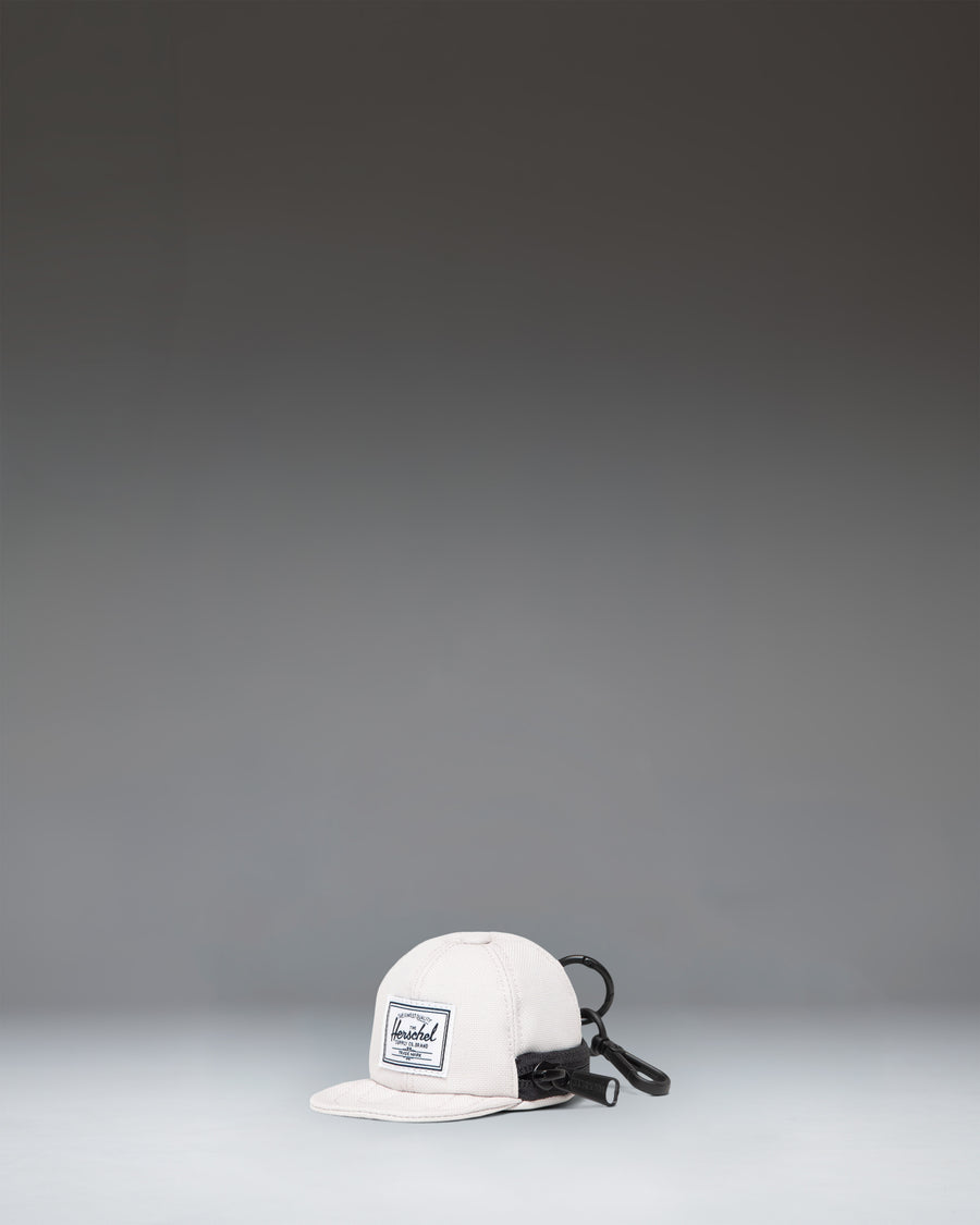 Herschel Supply Co. Sylas Classic Cap Bag Charm in the off-white Moonbeam colorway.