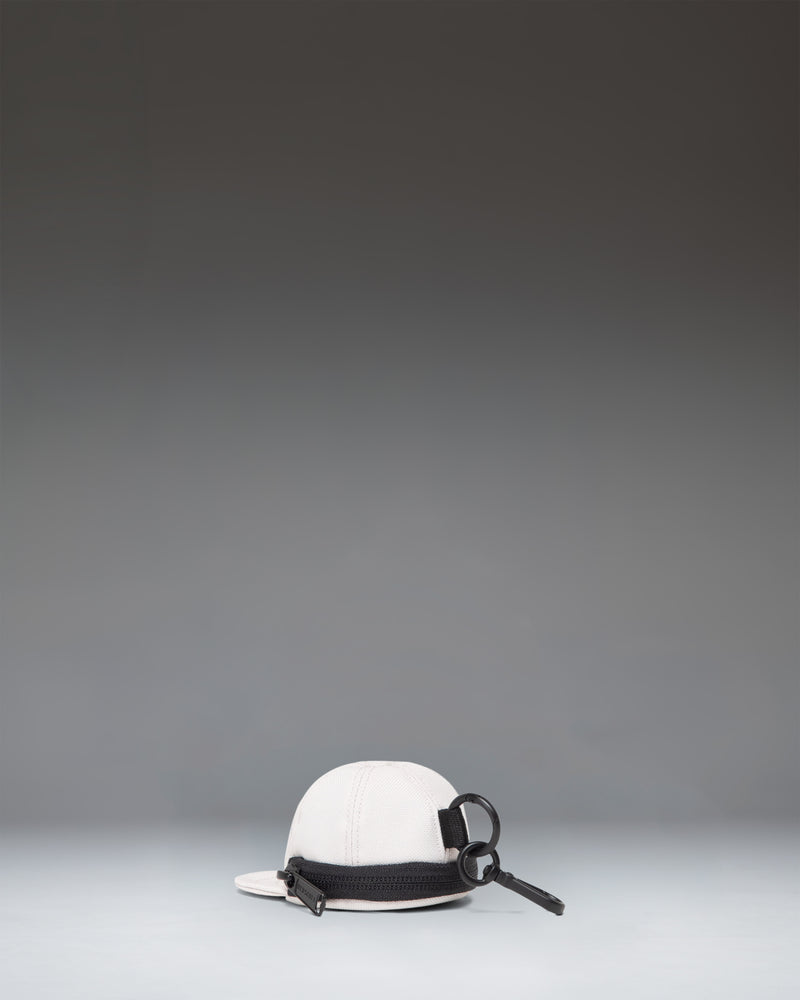 Herschel Supply Co. Sylas Classic Cap Bag Charm in Moonbeam. Miniature cap keychain accessory.