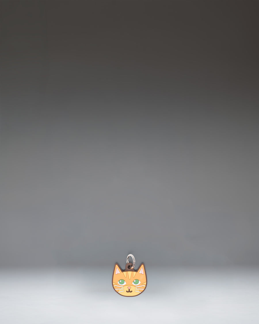 Herschel Cat Bag Charm in Orange Cat colorway, featuring a stylized orange cat design.